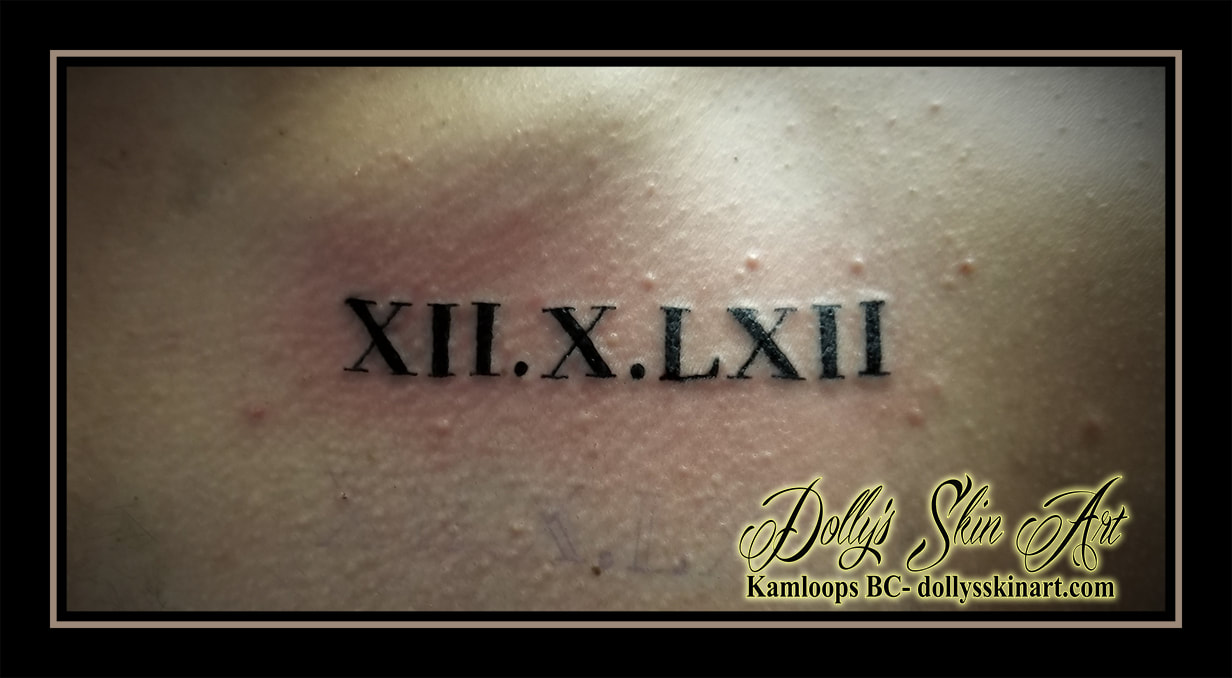 black roman numeral date 12 10 62 1962 lettering font small tattoo kamloops dolly's skin art