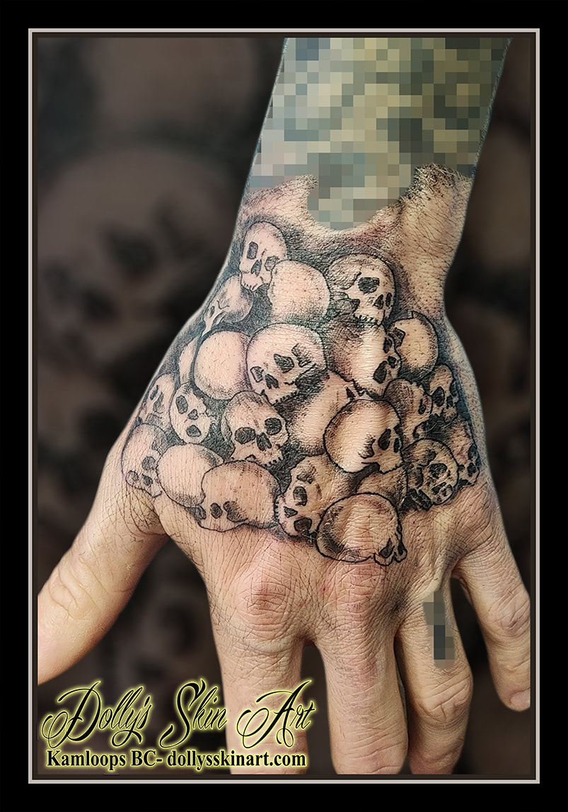 skulls tattoo hand black and grey pile of skulls tattoo kamloops dolly's skin art
