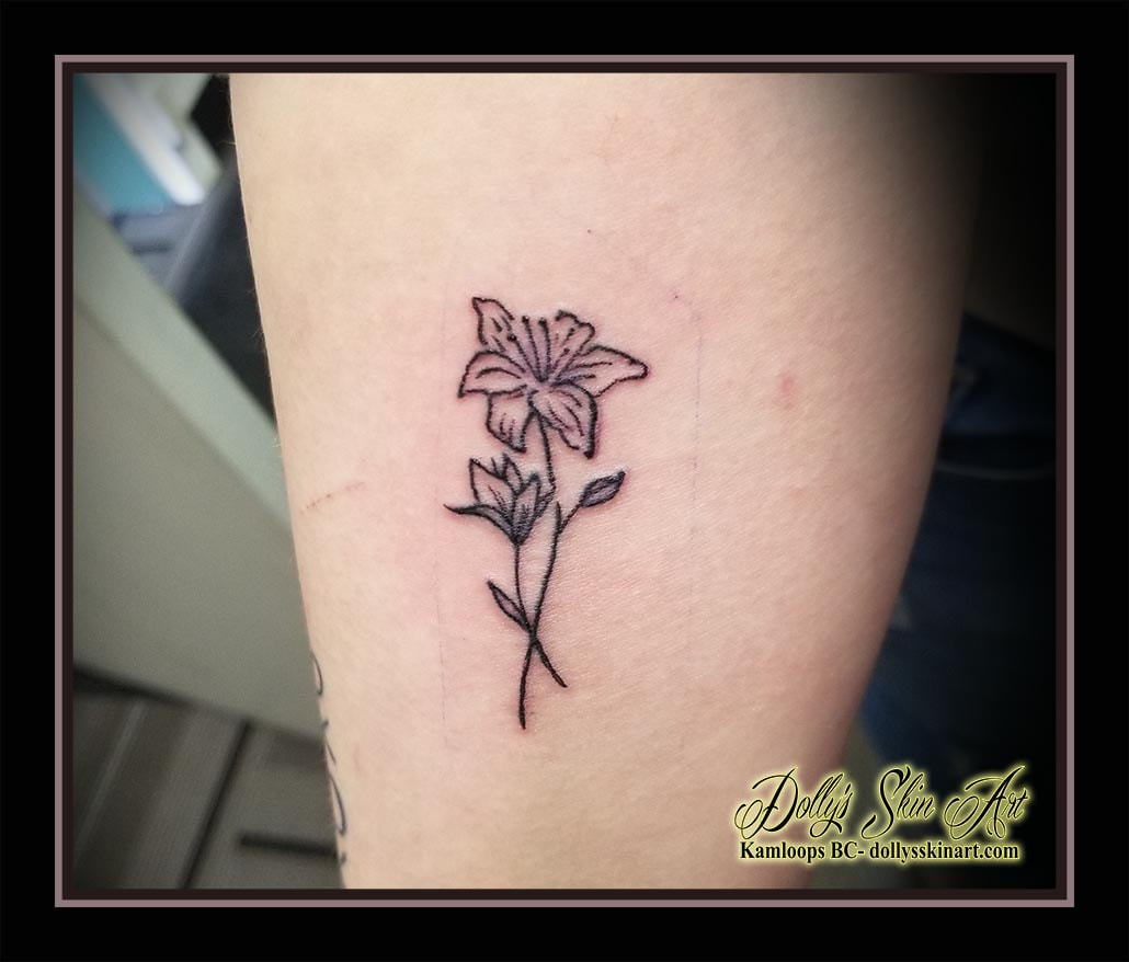 small flowers tattoo linework outline simple tiny tattoo kamloops dolly's skin art
