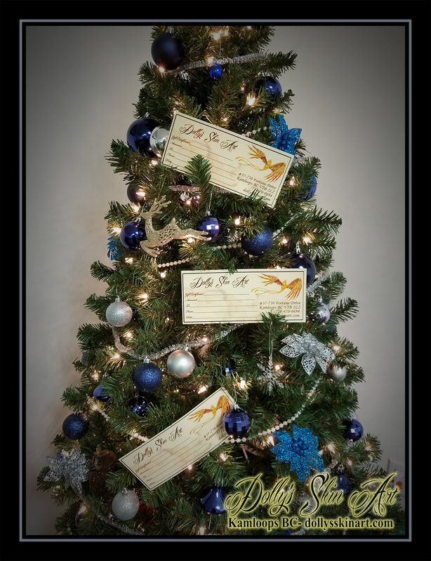 christmas tree gift certificate blue silver green lighted ornaments kamloops tattoo dolly's skin art