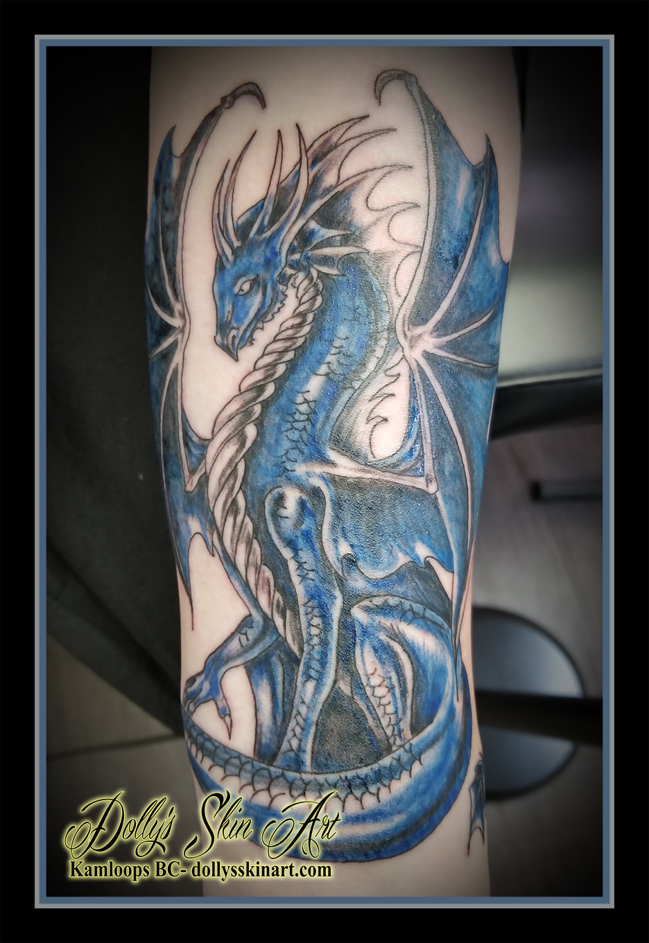 blue black dragon forearm traditional style shaded wrapped kamloops tattoo dolly's skin art