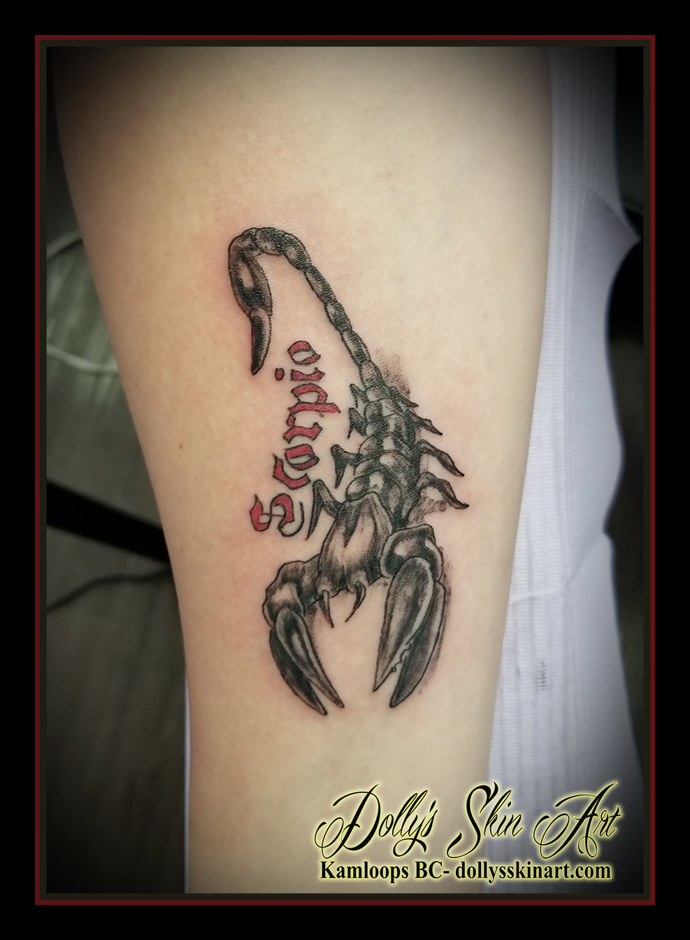 black and grey scorpion red lettering scorpio forearm tattoo kamloops dolly's skin art