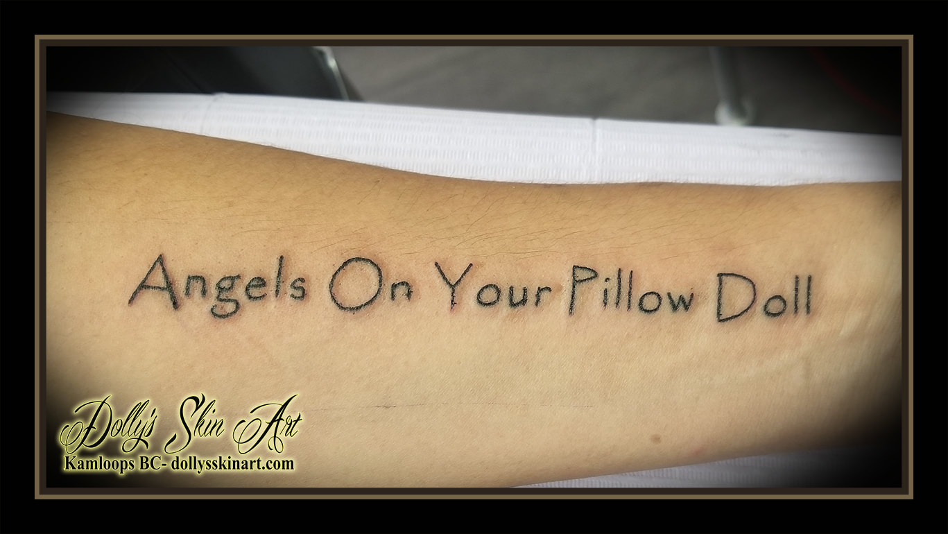 angels on your pillow doll tattoo black lettering font script forearm tattoo kamloops dolly's skin art